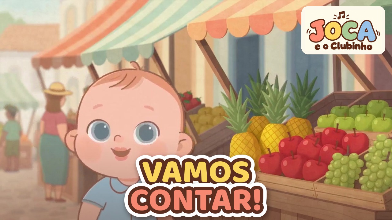 Joca em pé diante de uma banca de feira com abacaxi, maçãs e uvas, no clipe Cestinha de Frutinhas
